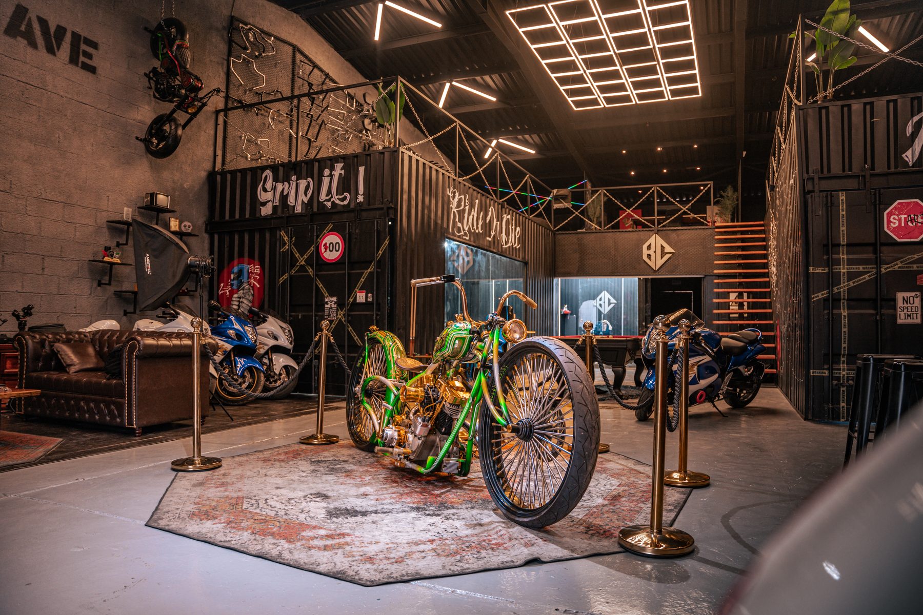 Green custom show bike displayed in the workshop